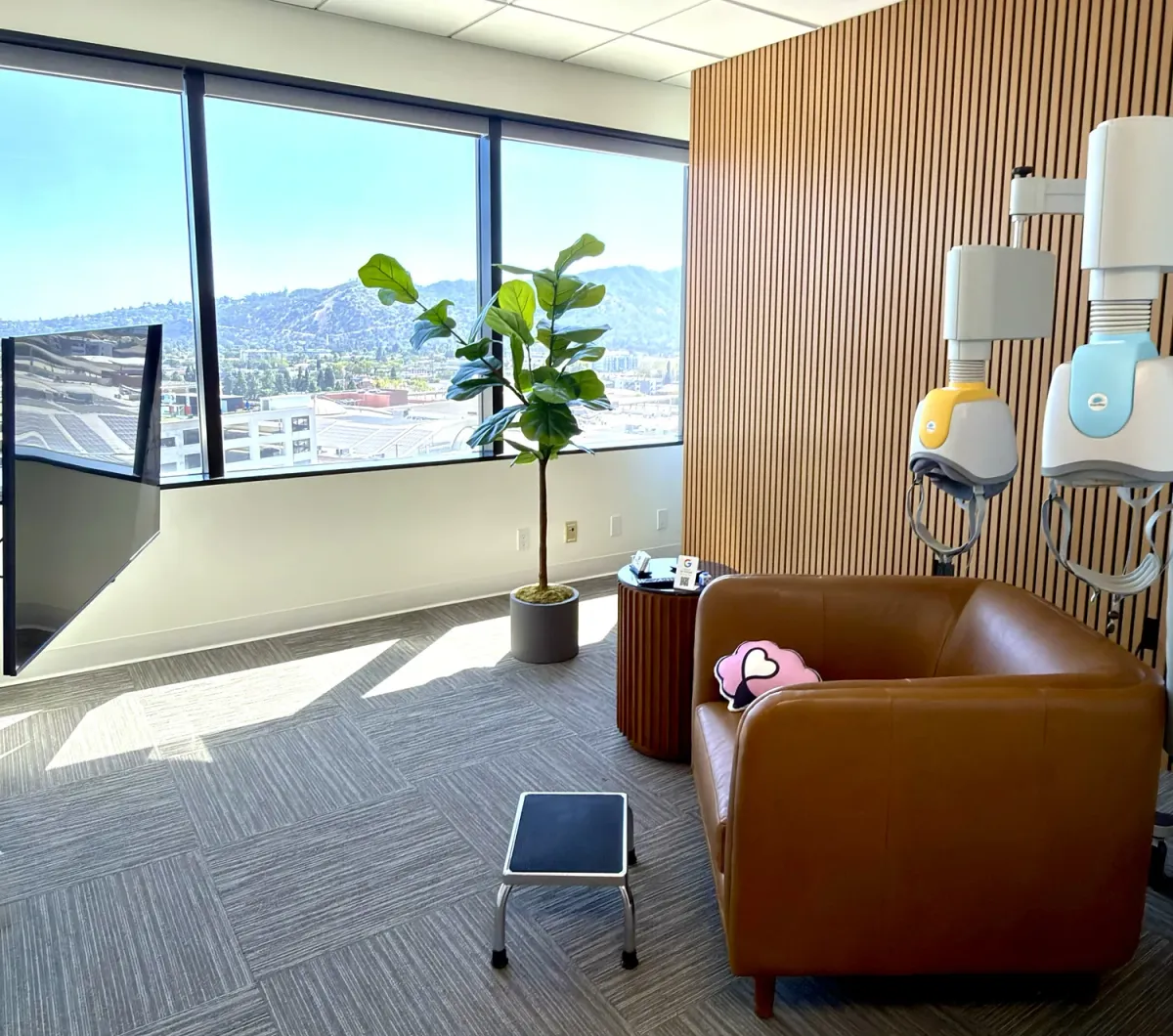 A private treatment room at Breakthrough TMS in Glendale with a comfortable chair and city view